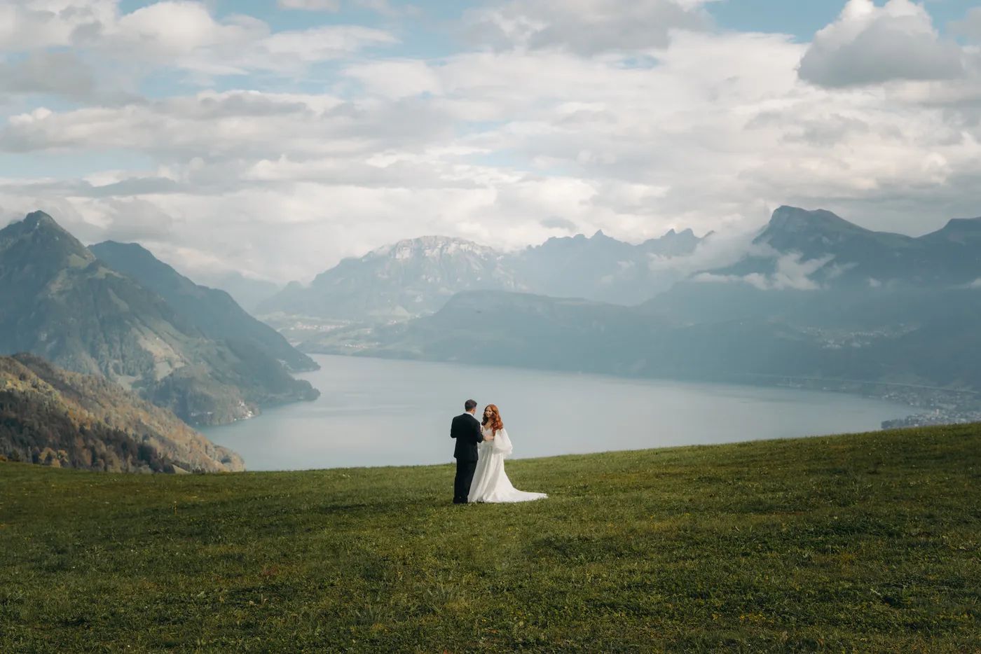 Bride and groom in Lake Luzern on their wedding day in Switzerland