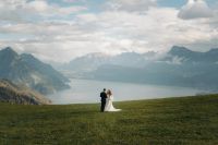 Bride and groom in Lake Luzern on their wedding day in Switzerland
