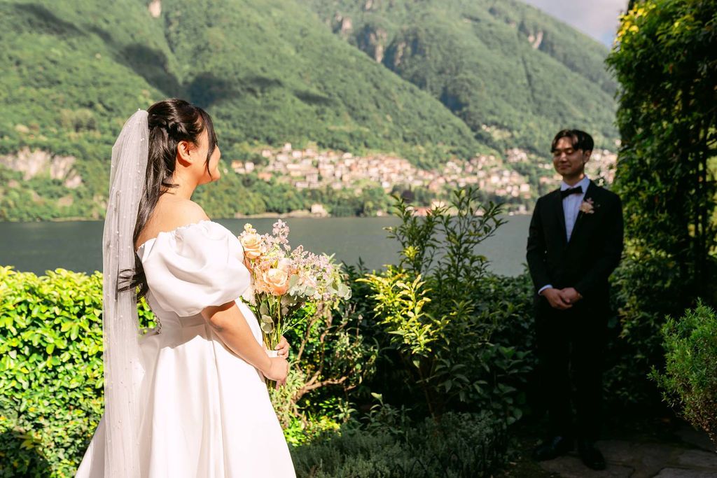 Bride and groom looking at each other during the ceremony of their elopement in Italy along the Lake Como