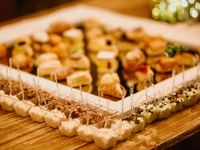 Aperitifs served on wooden trays for the drinks reception of a destination wedding in Tuscany
