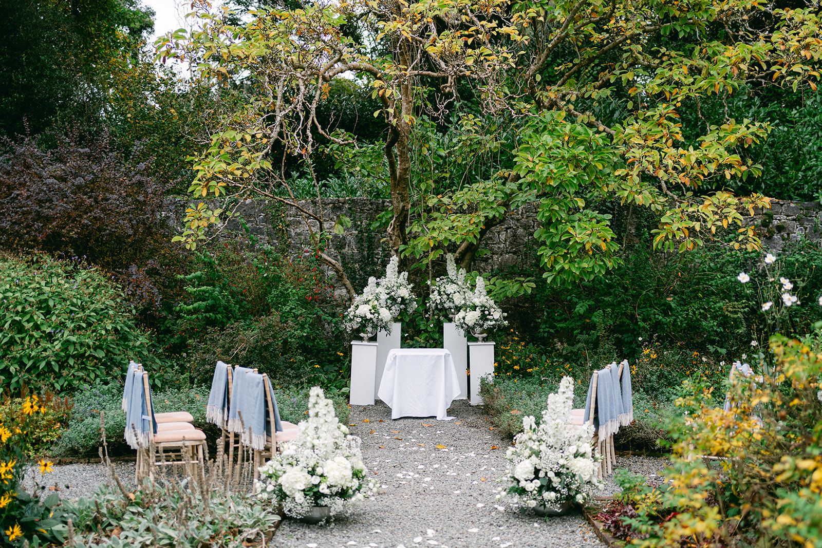 Garden chair and arch arrangement for an outdoor small wedding in Ireland