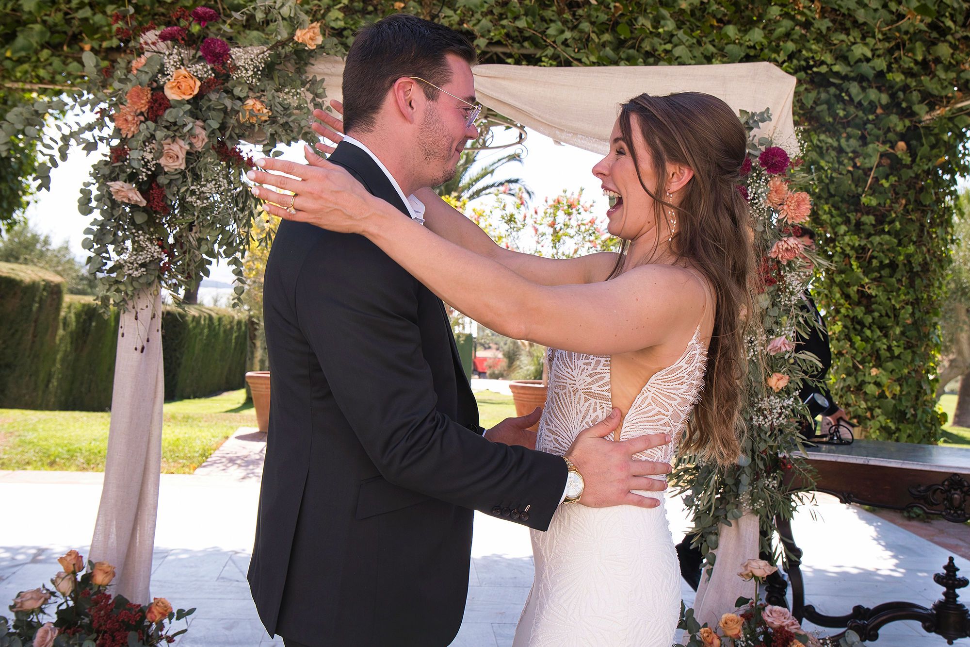 Bride and groom having a light moment during the ceremony of their big day, arranged by our destination wedding planner in Spain