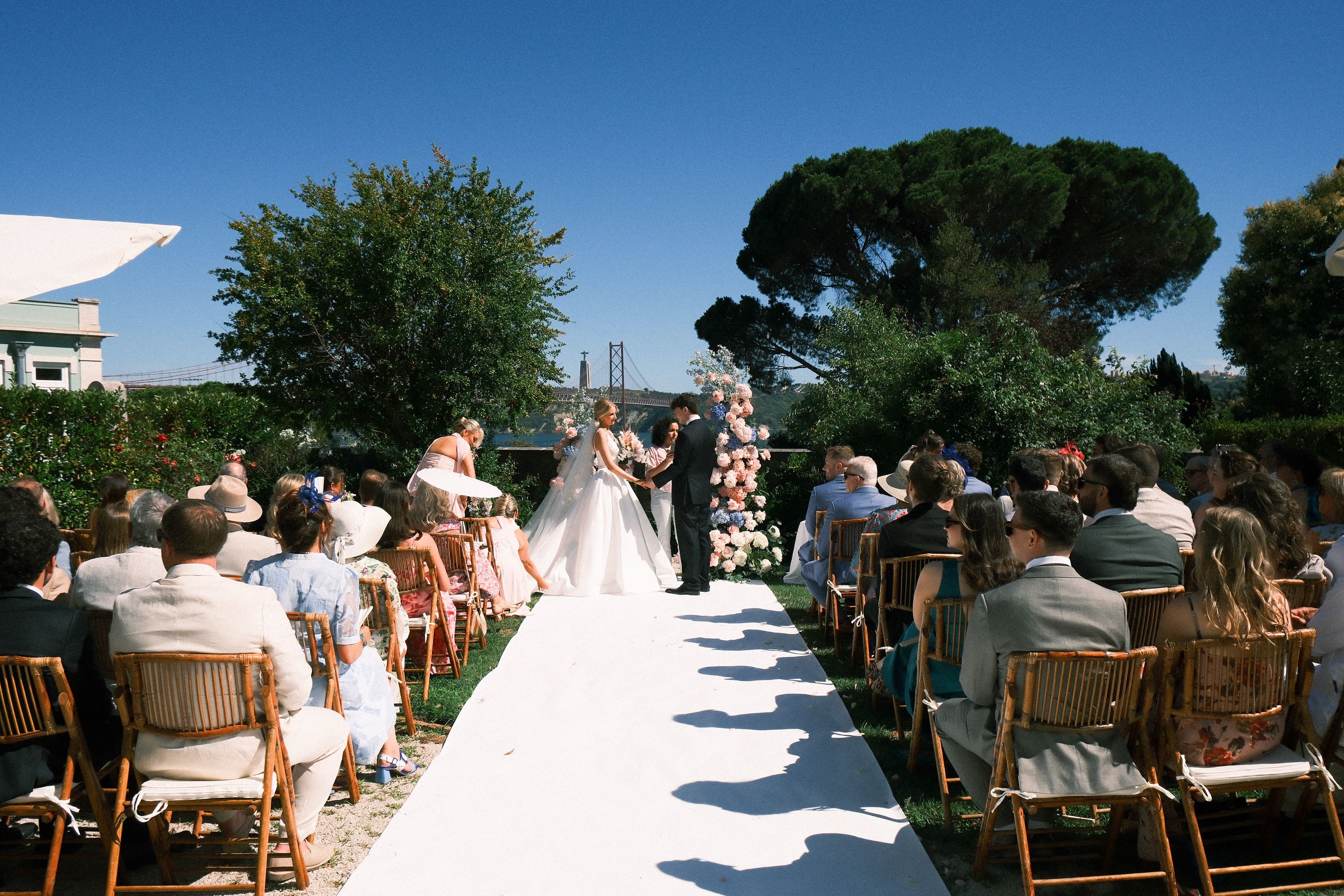 Outdoor wedding ceremony with guests overlooking Lisbon at a small wedding in Portugal