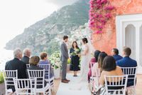 Intimate outdoor wedding ceremony in Italy at a terrace of a villa with views of the Amalfi Coast