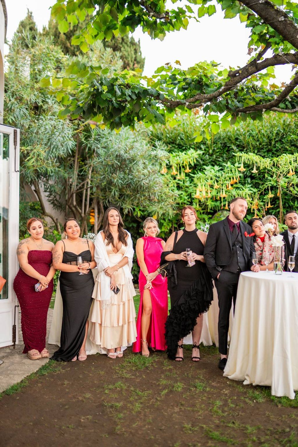 Guests stand as they watched the outdoor ceremony of a vow renewal in Italy
