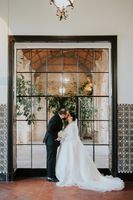 Bride and groom kiss inside a historic palace during their vow renewal in portugal