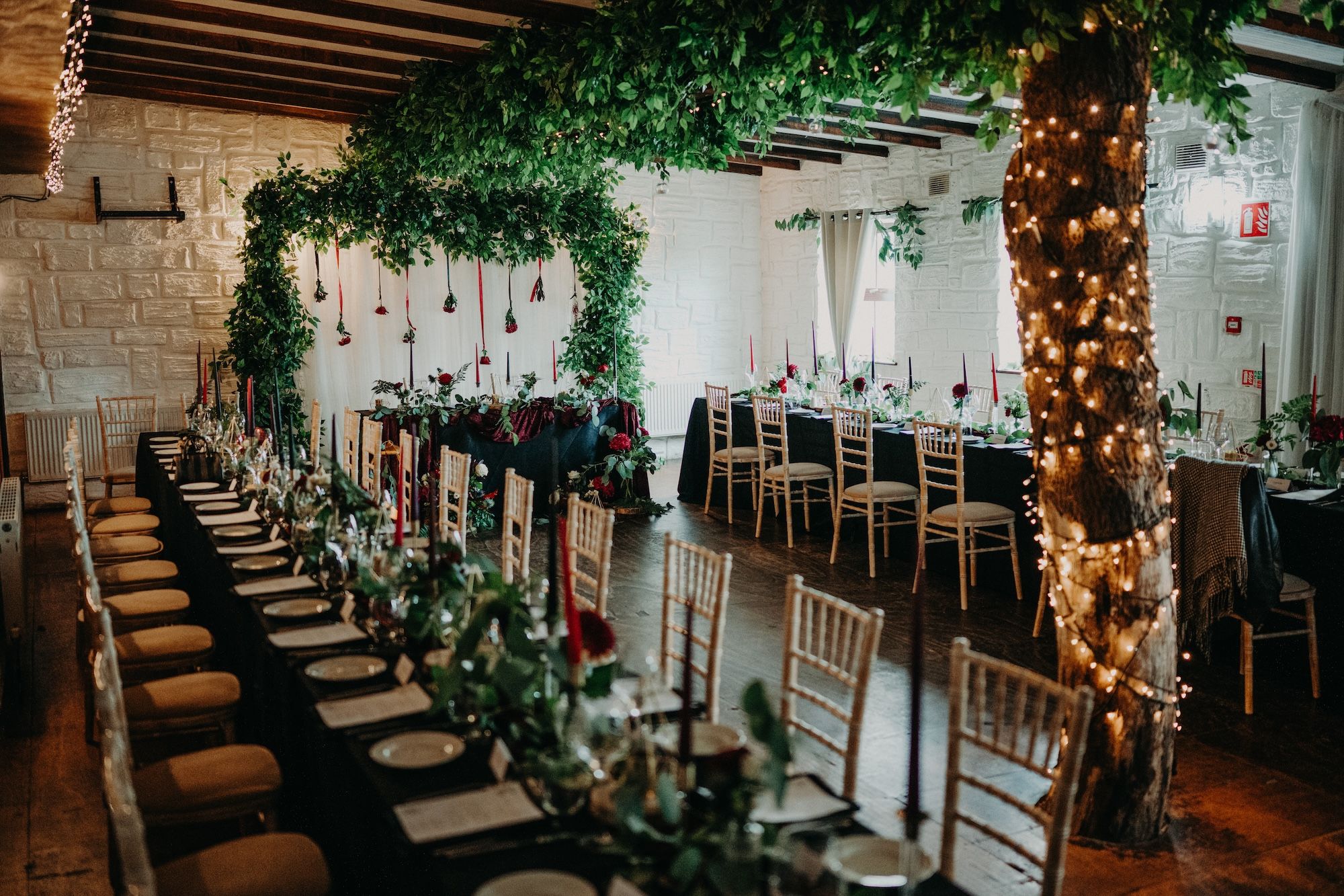 A traditional pub was decorated with greens, lights, and candles for an intimate wedding in Ireland