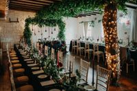 A traditional pub was decorated with greens, lights, and candles for an intimate wedding in Ireland