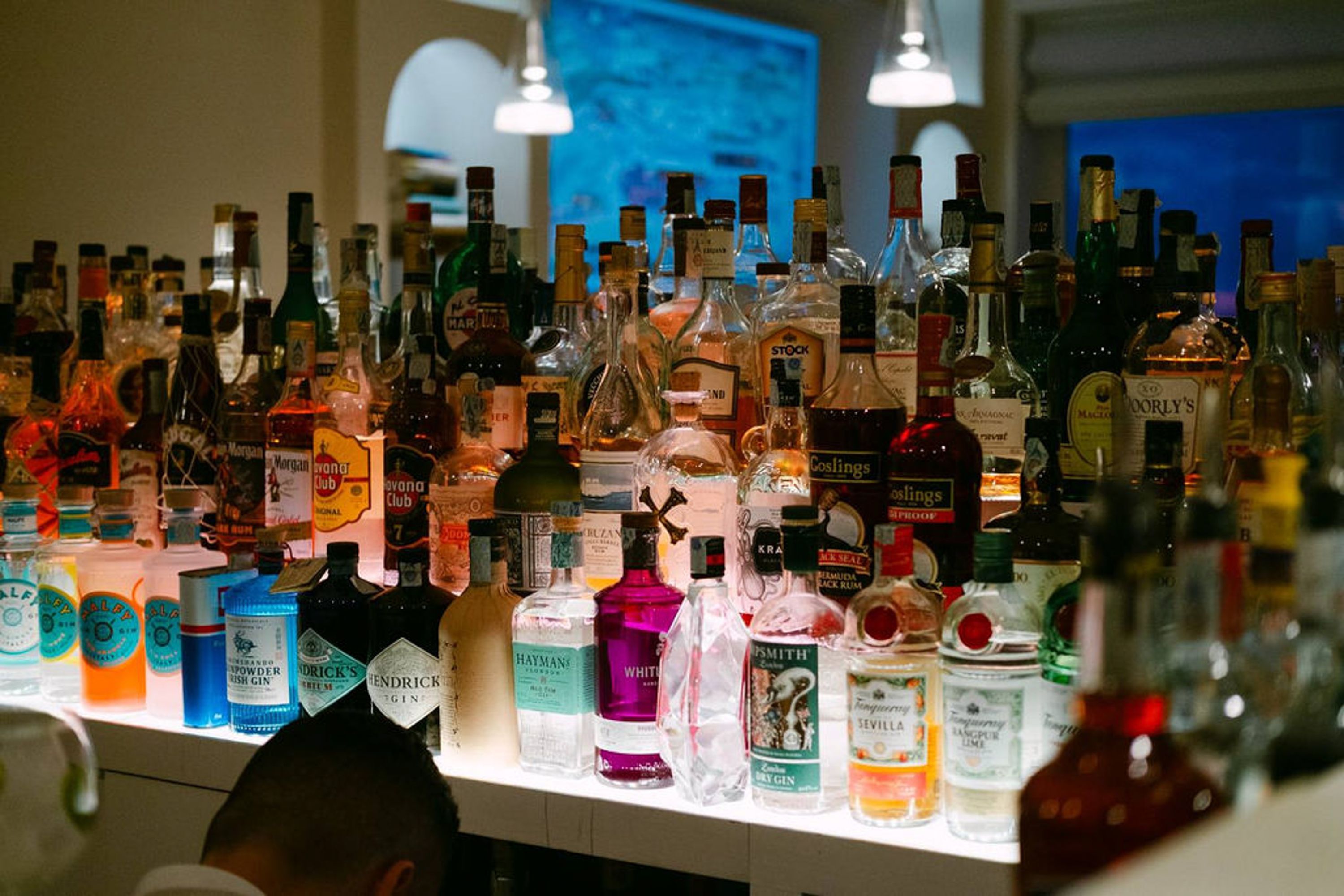 Elegant reception bar setup at an intimate wedding in Italy featuring premium spirits and cocktails
