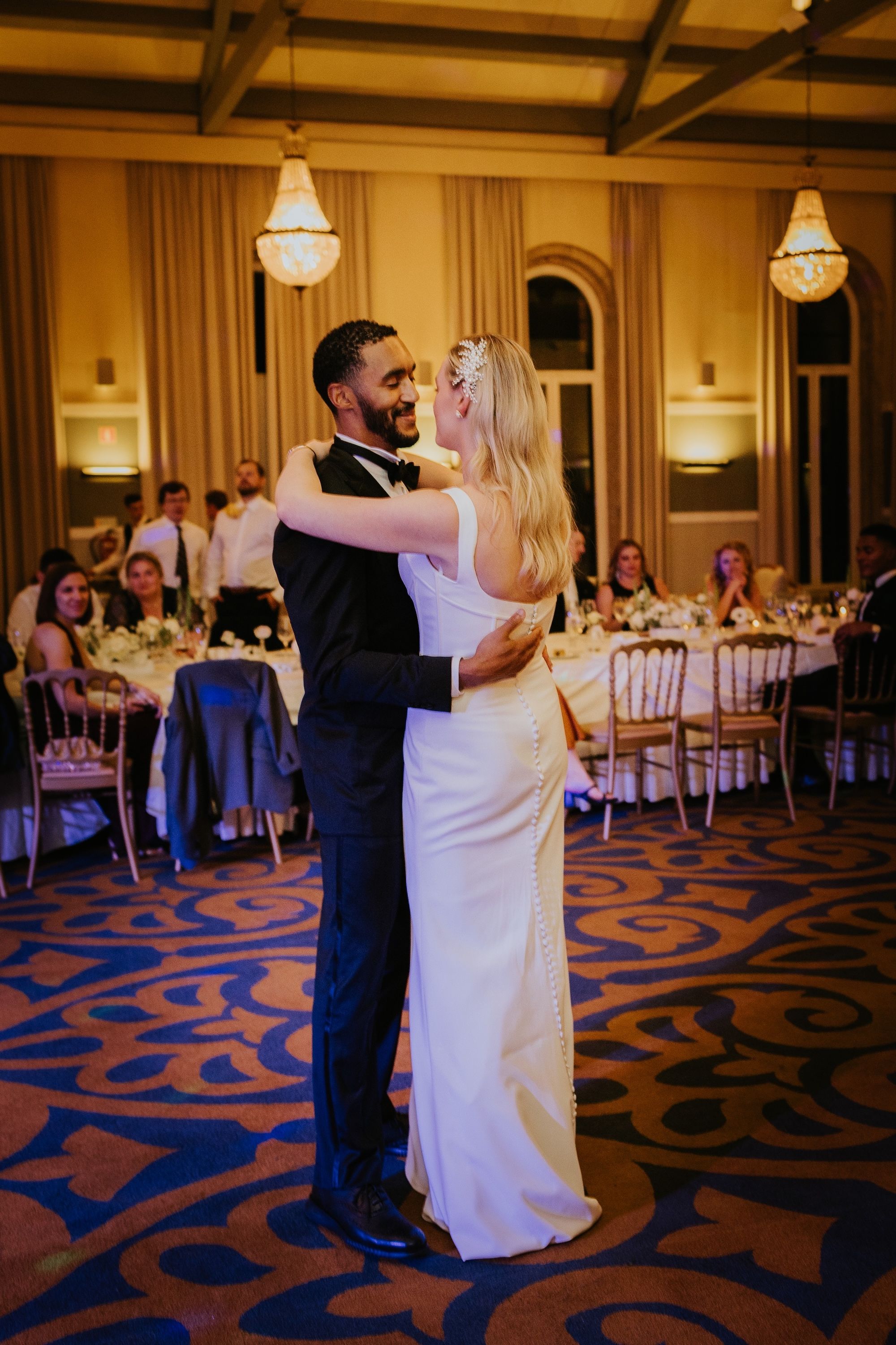 Newlyweds perform their first dance during the reception of their intimate wedding in Portugal