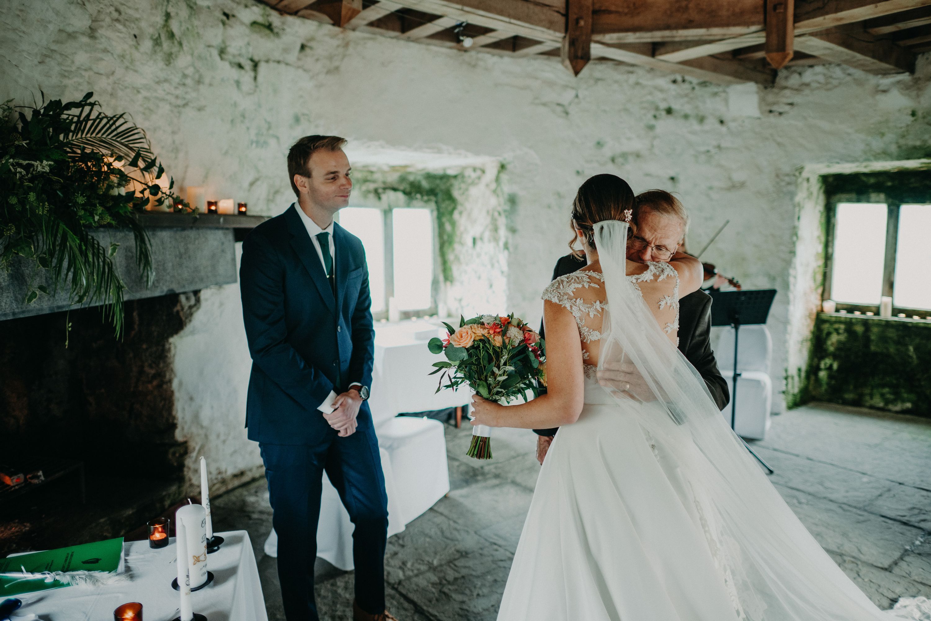 Emotional father-daughter embrace during a small wedding in Ireland ceremony.
