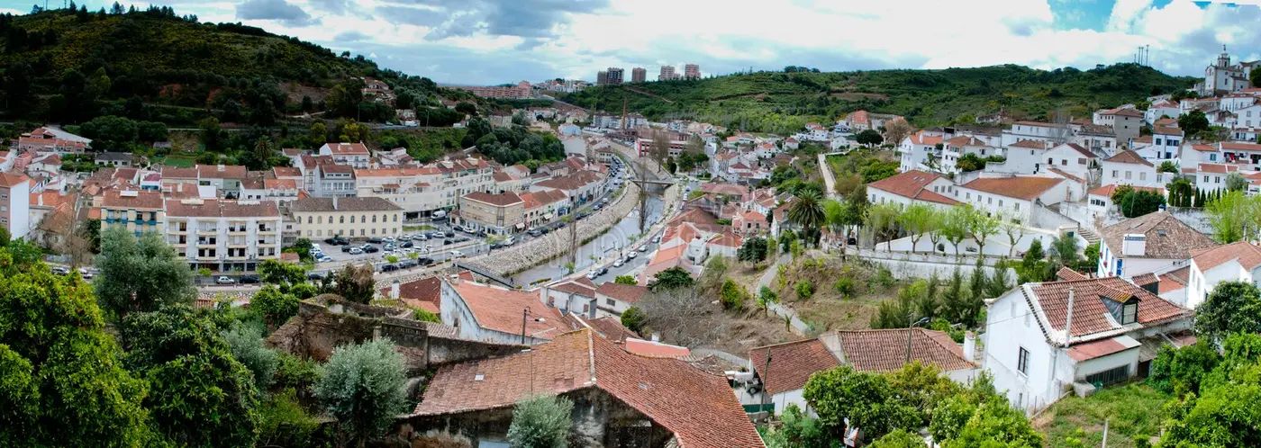 Alenquer countryside landscape dotted with medieval buildings and lush greenery