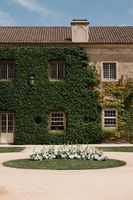 Ive-covered palace with a courtyard in front at Alenquer, Portugal