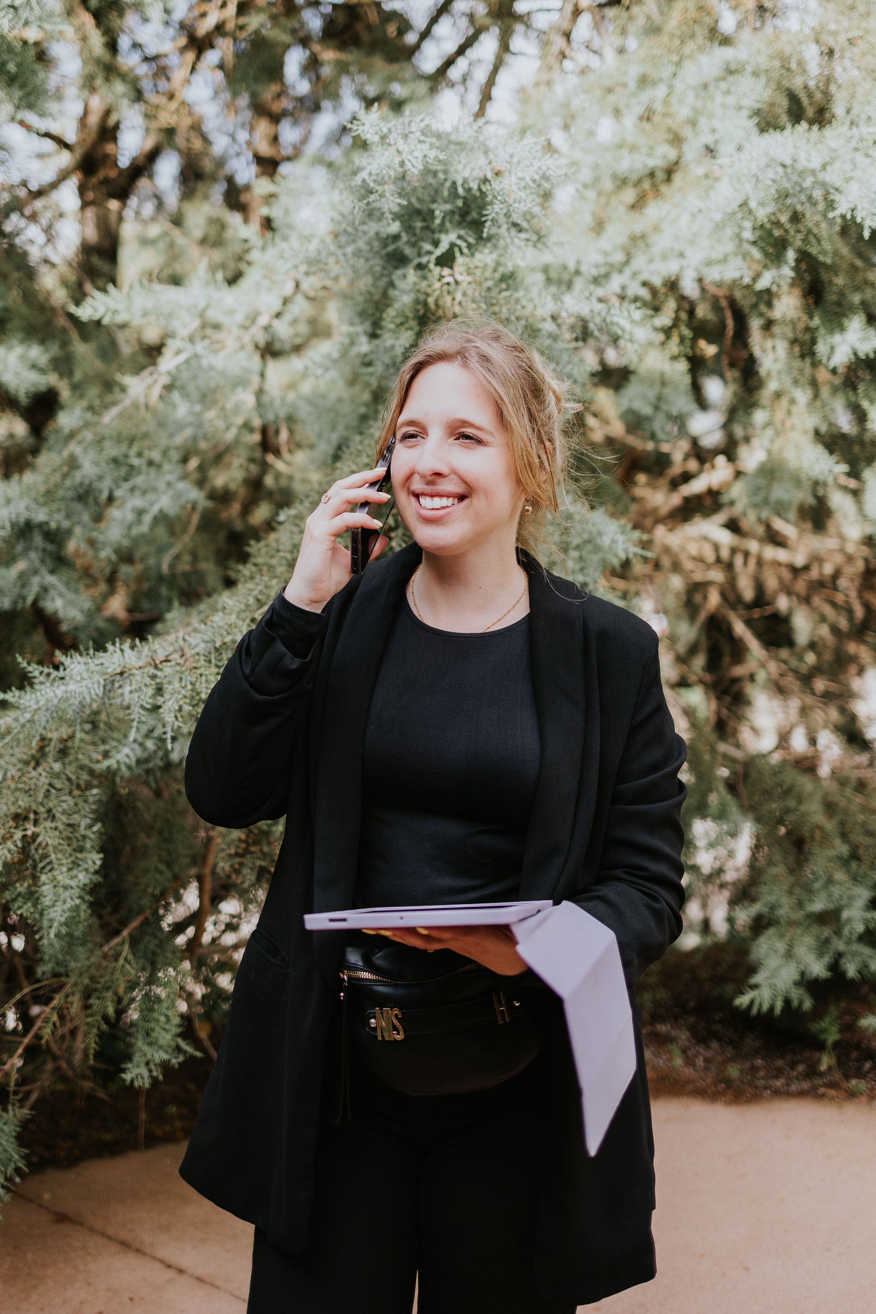 Destination wedding planner in Portugal taking a phone call