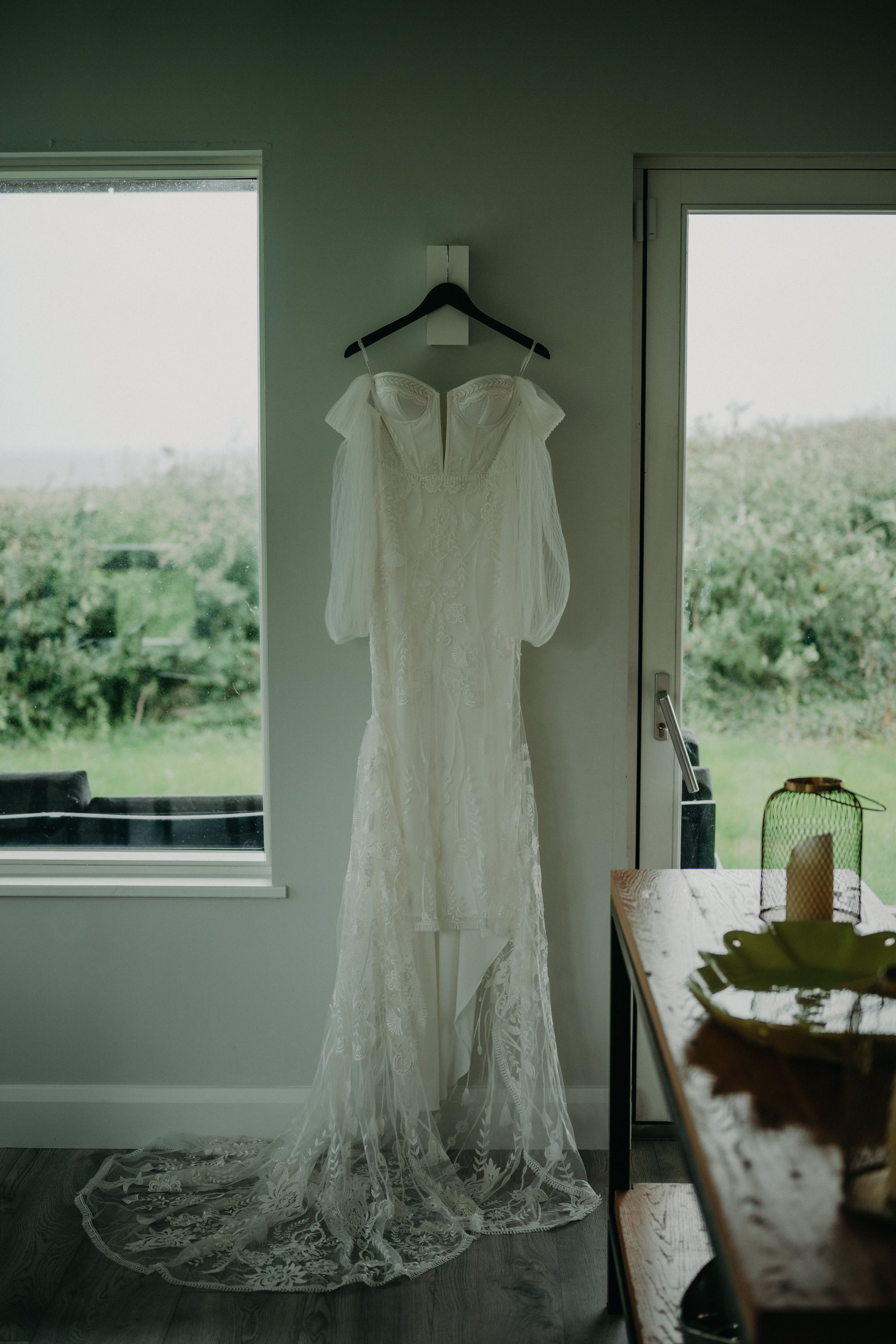 A long, off-shoulder white wedding dress for our bride who got married in Ireland
