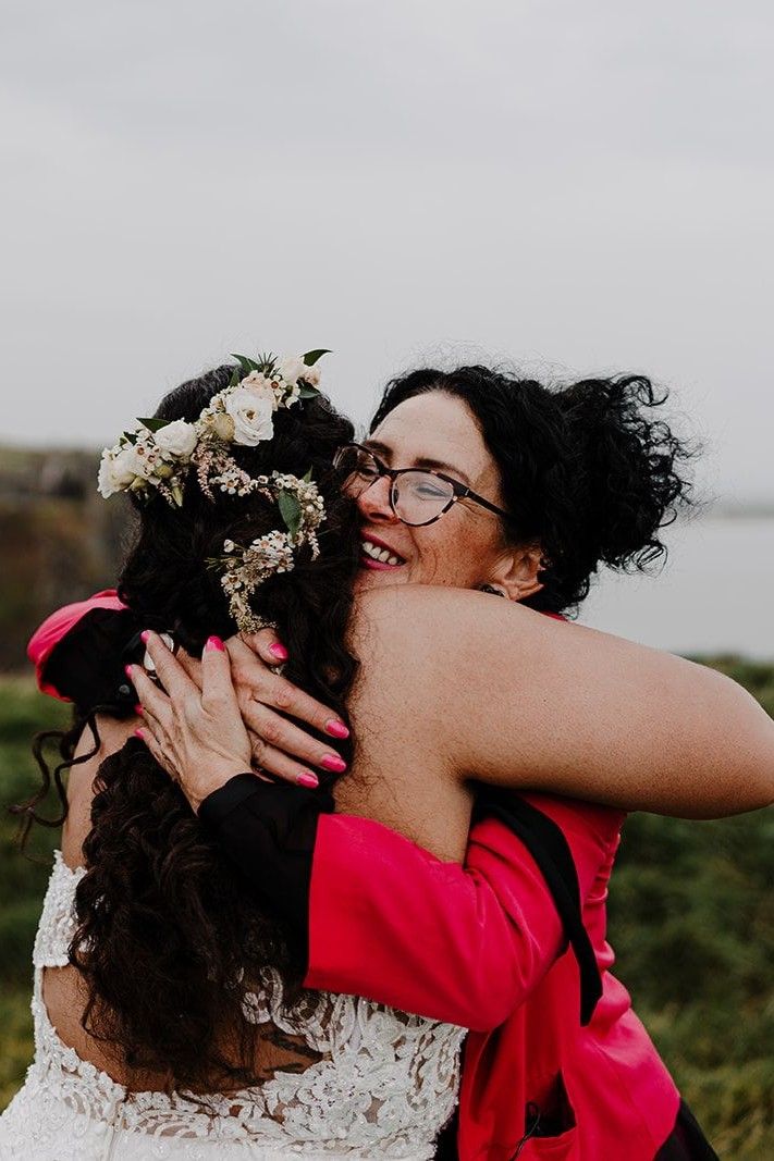 Bride hugging her wedding planner after the ceremony