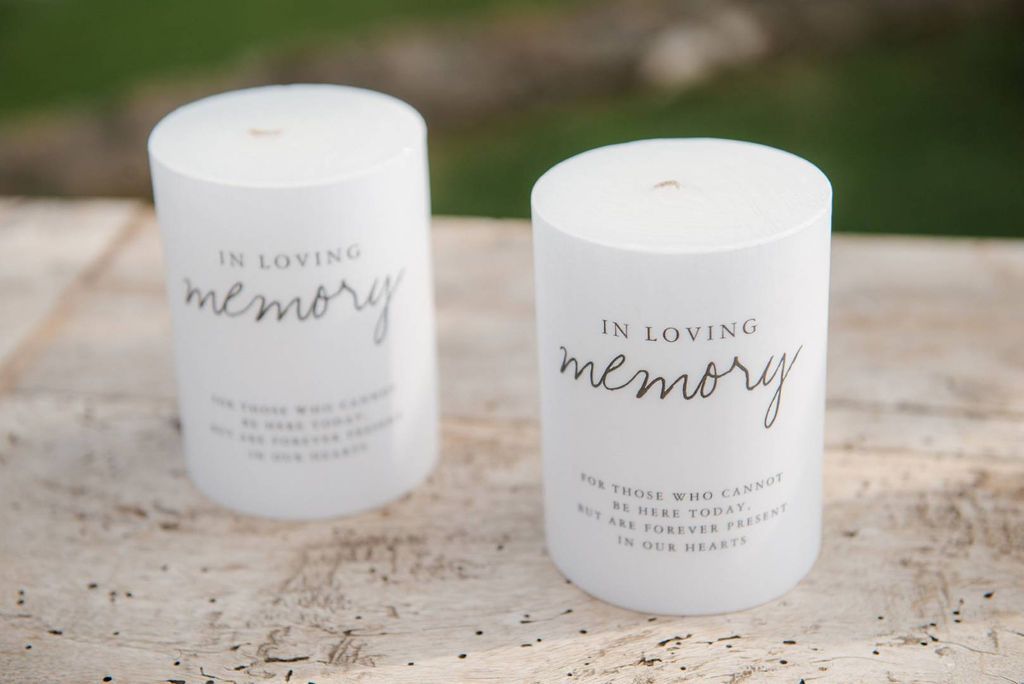 White candles displayed in a ceremony of a micro wedding in Italy to remember the couple's departed loved ones