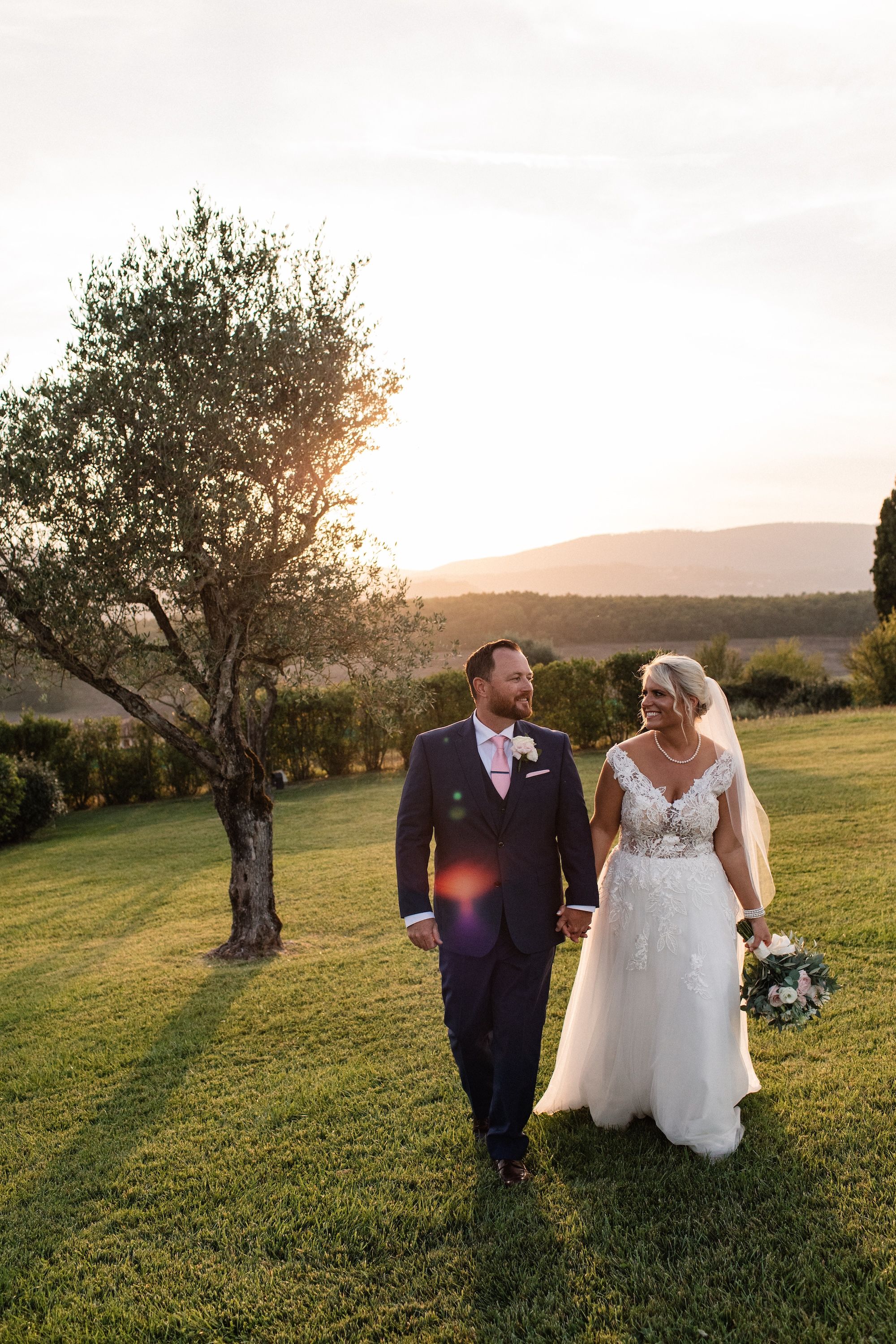 Newlyweds having a sunset photoshoot after their destination wedding ceremony Italy in a Tuscan villa