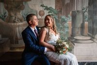 Bride and groom having a romantic indoor photoshoot in the Tuscan villa where they got married in Tuscany