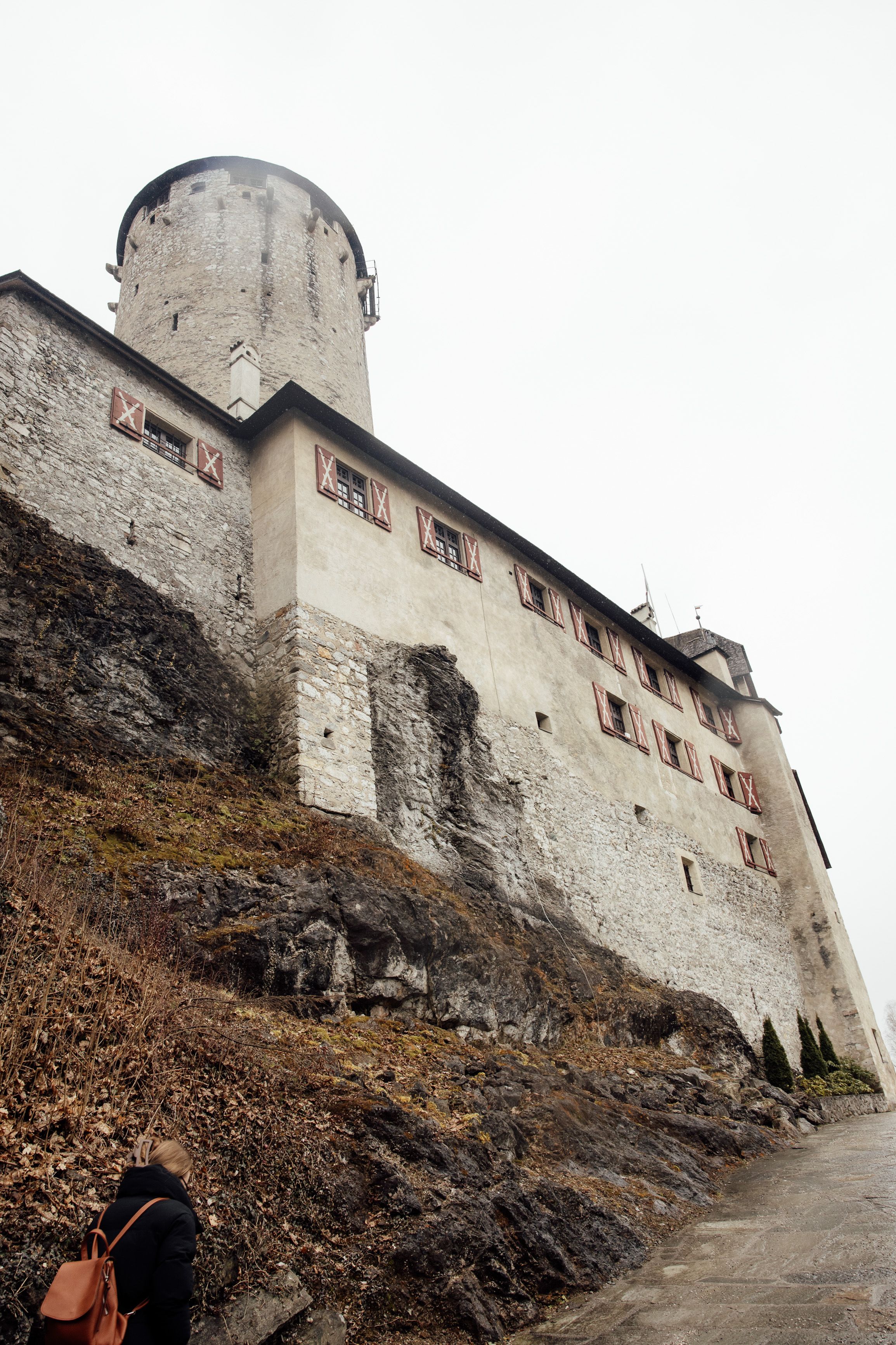 Historic Austrian castle venue overlooking rocky grounds during an intimate wedding in Austria
