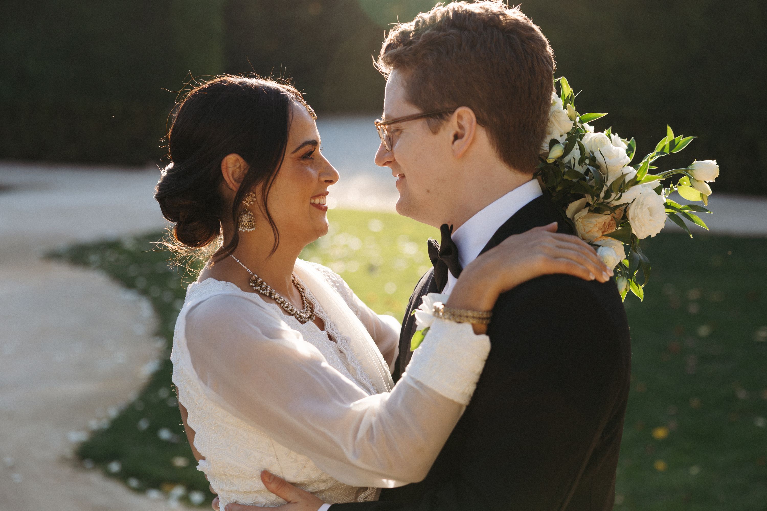Bride and groom embracing in golden hour light after an intimate wedding in Portugal