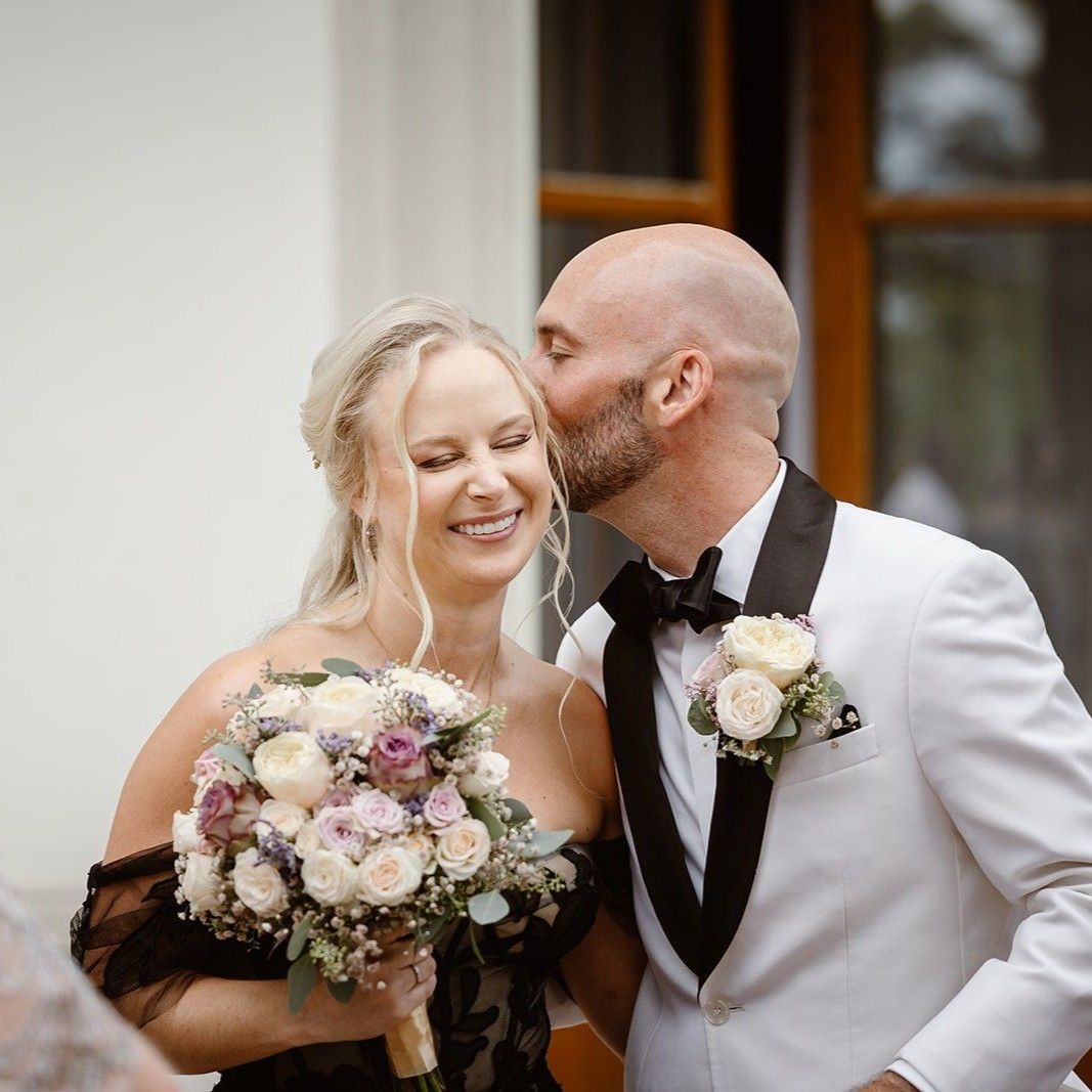 Groom kissing bride at a wedding in Switzerland