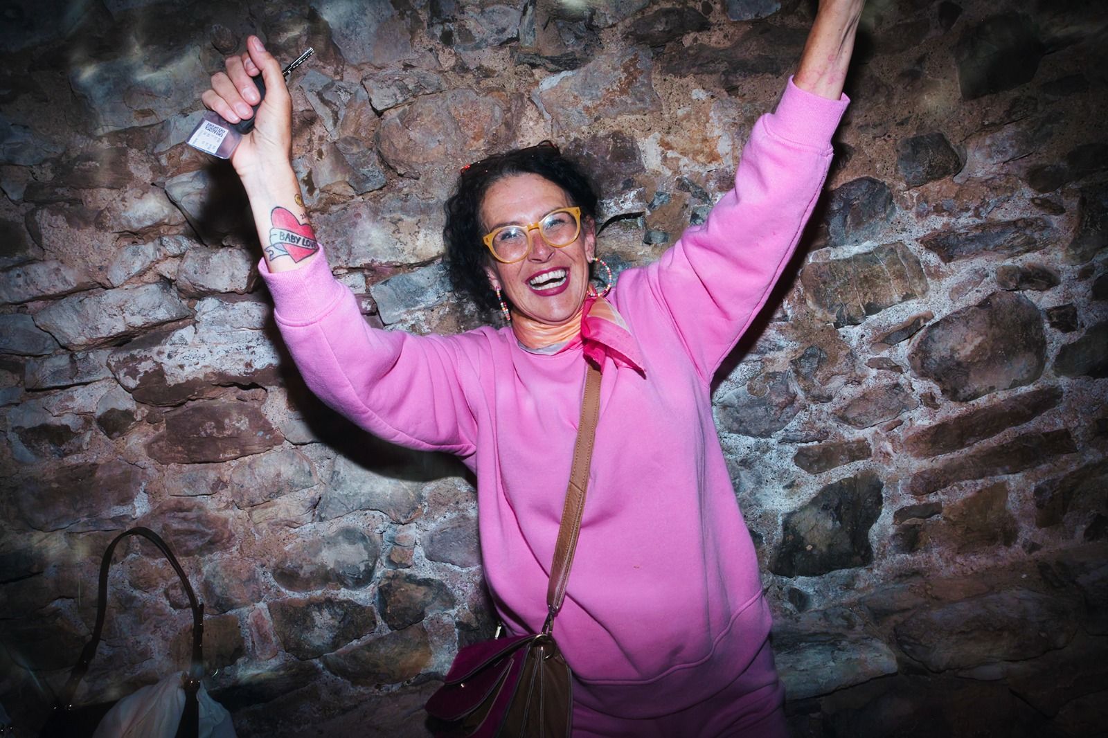 Our wedding planner in Spain dances in the middle of guests while everyone is having fun during a destination wedding in Spain