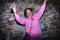 Our wedding planner in Spain dances in the middle of guests while everyone is having fun during a destination wedding in Spain