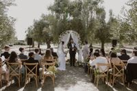 An outdoor ceremony in Alentejo’s vineyards with a small group of guests during an intimate wedding in Portugal