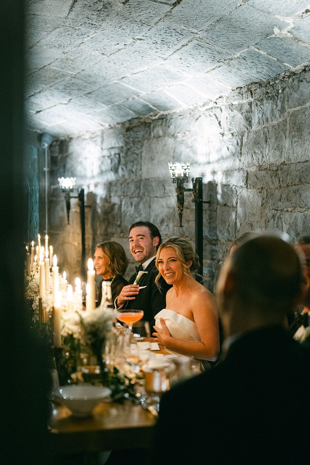 Bride and groom with their small group inside a castle room having the reception for their Irish destination wedding