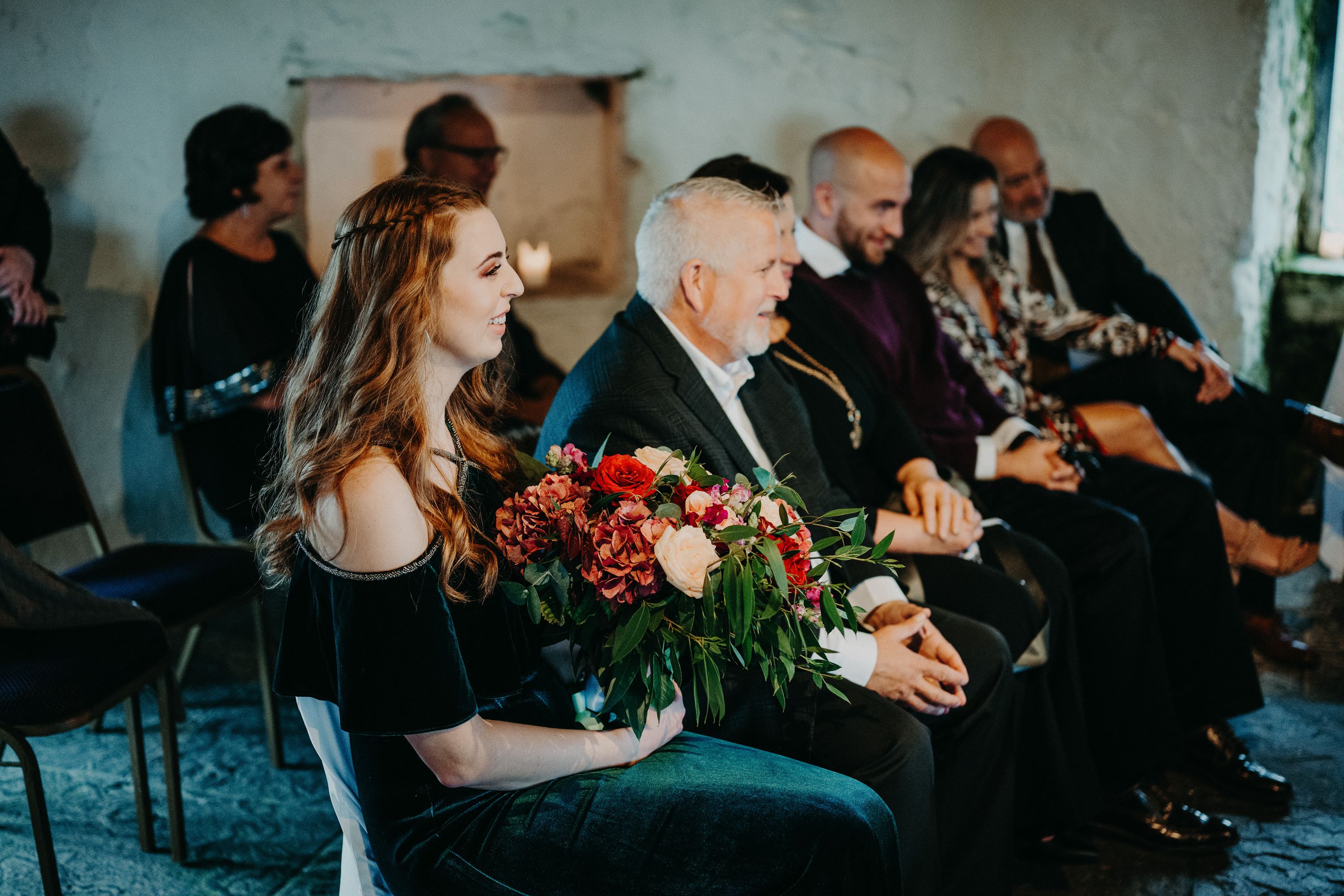 Wedding guests smiling during a heartfelt intimate wedding in Ireland ceremony