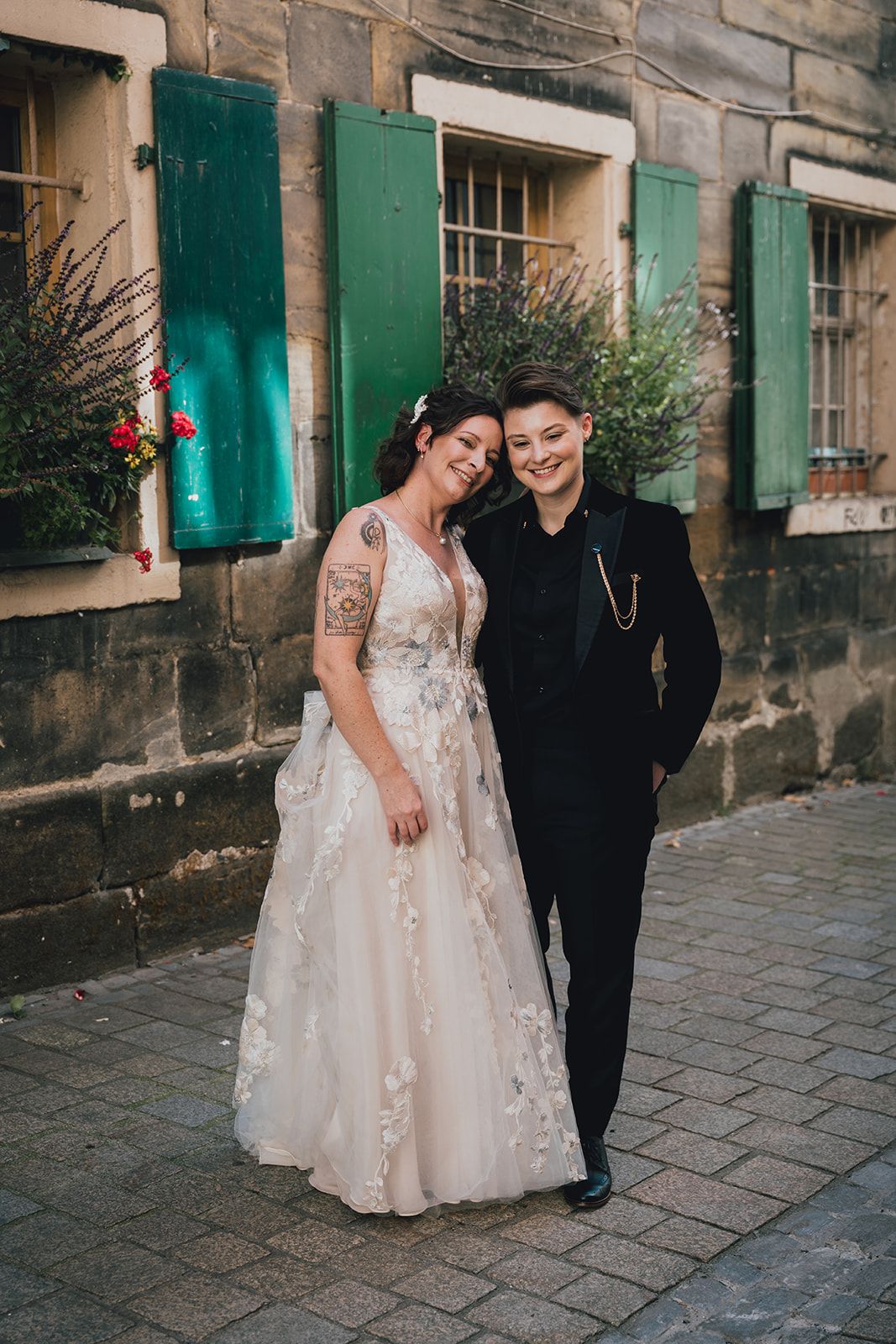 A bride and groom having their portrait taken for their intimate wedding