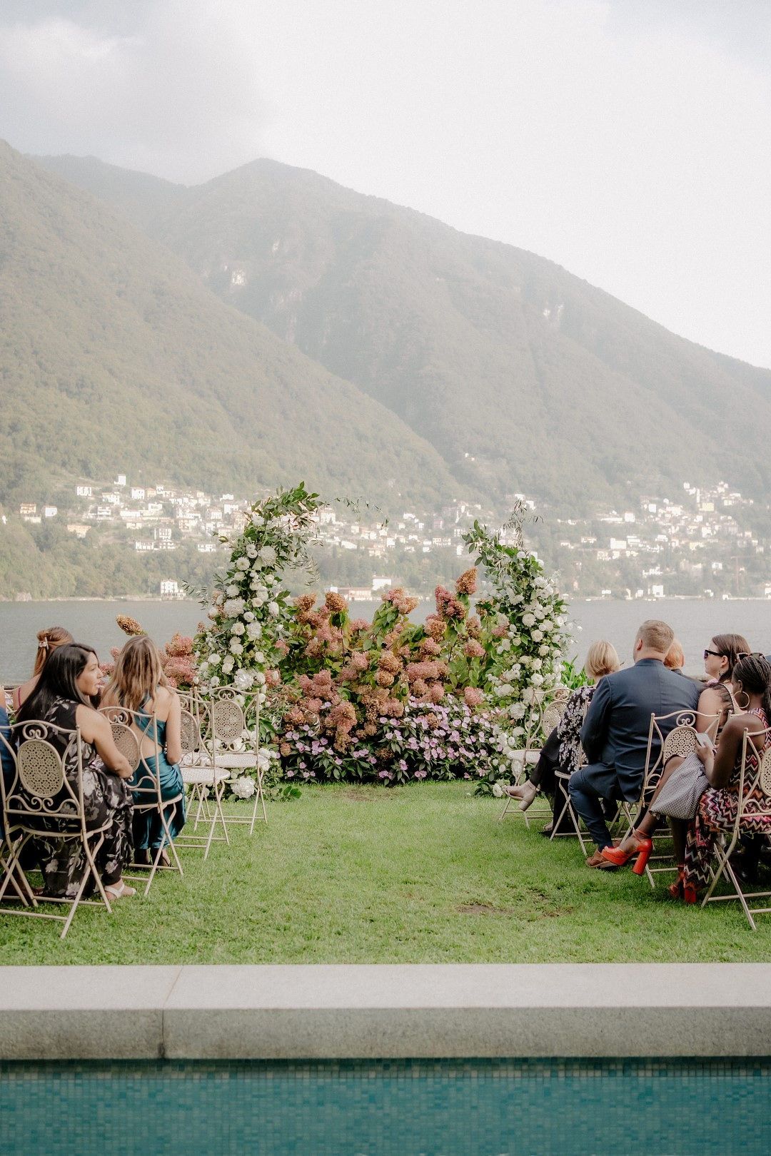 Beautiful garden of a villa fronting Lake Como arranged for a ceremony of an outdoor destination wedding in Italy