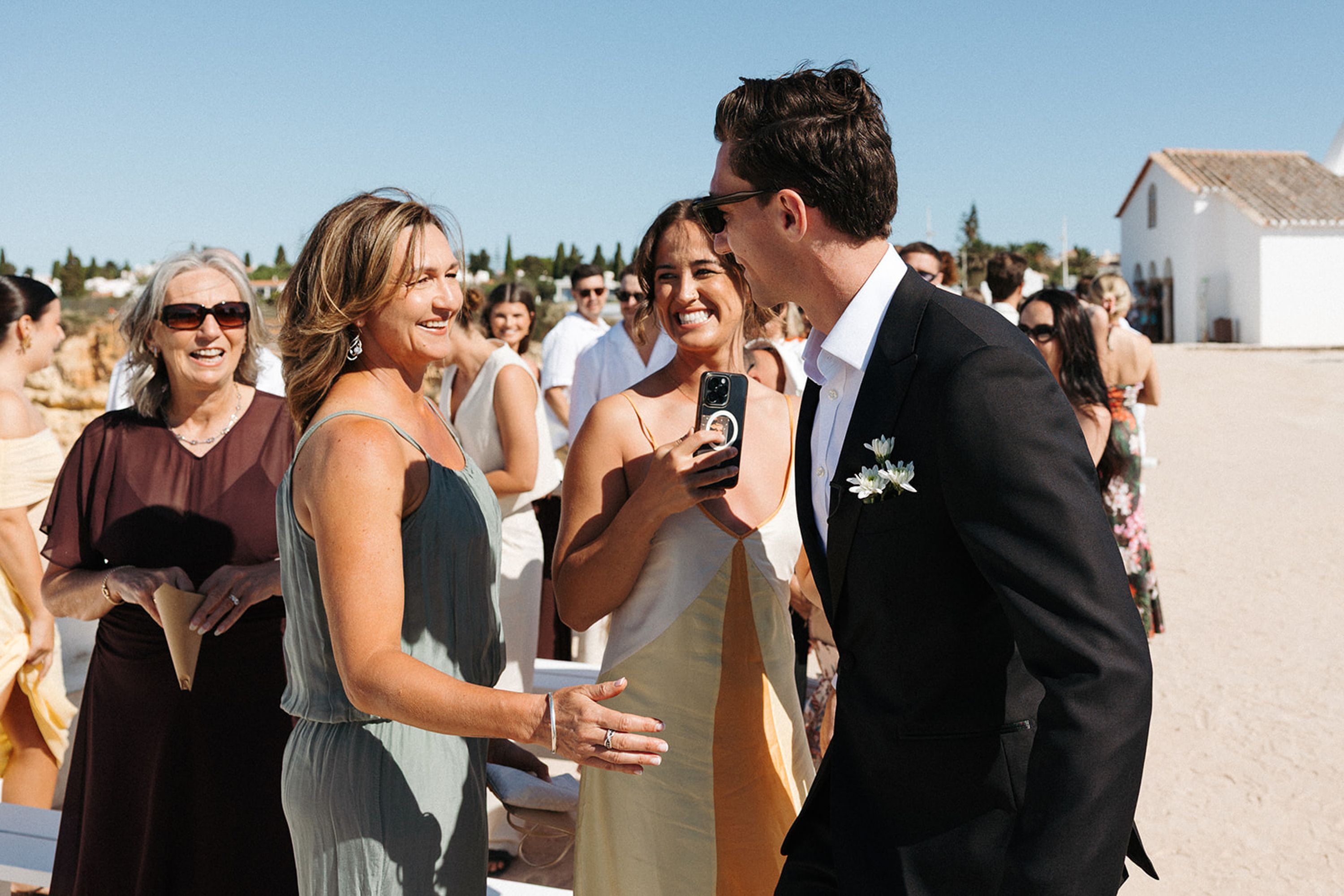 Family members congratulating the newlyweds on a scenic vineyard terrace during an intimate wedding in Portugal