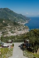 An ancient hotel with lush green gardens overlooking Amalfi villages, sea and mountain views during their elopement in Italy