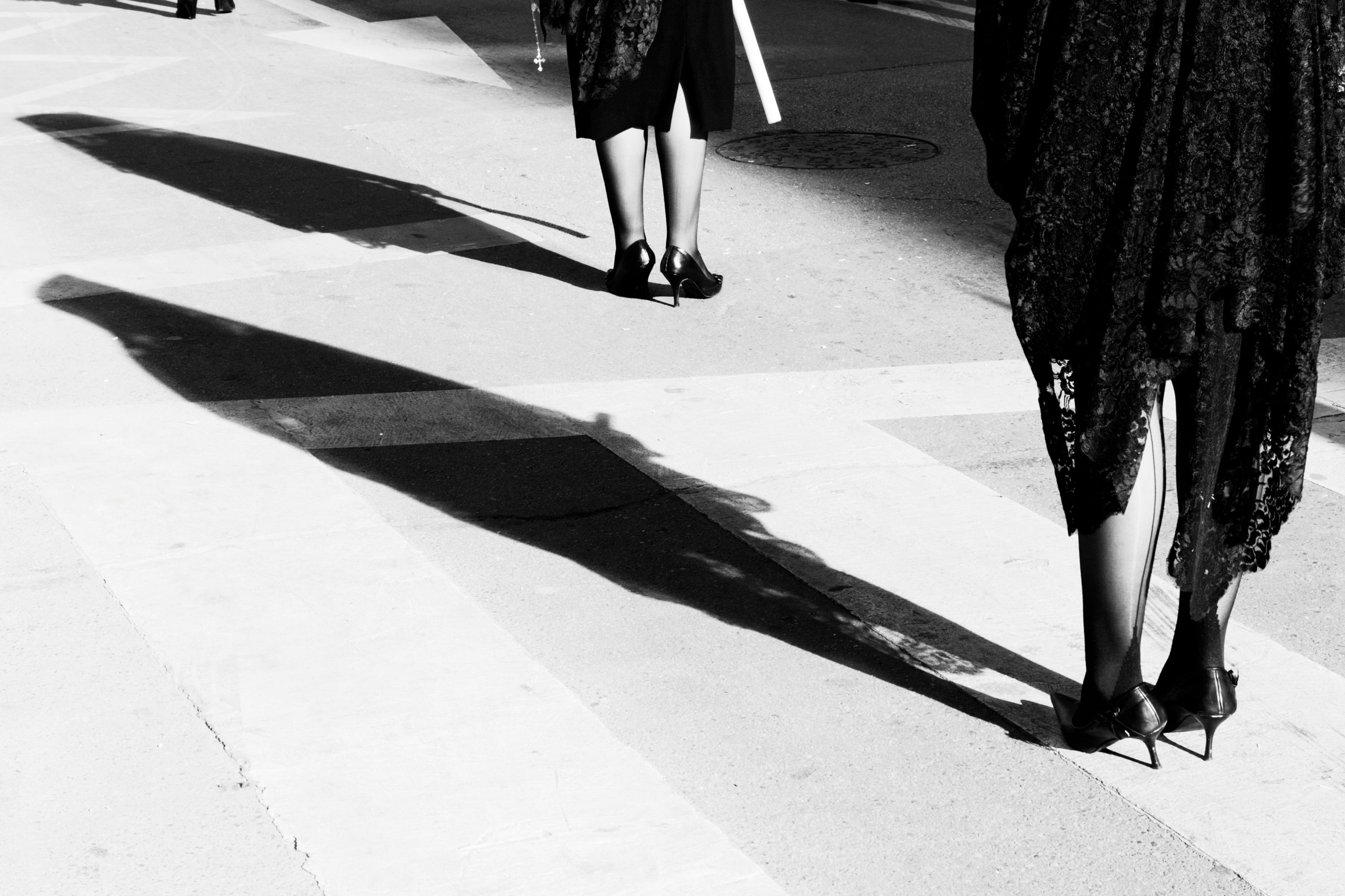detail photo of women in black lace gowns