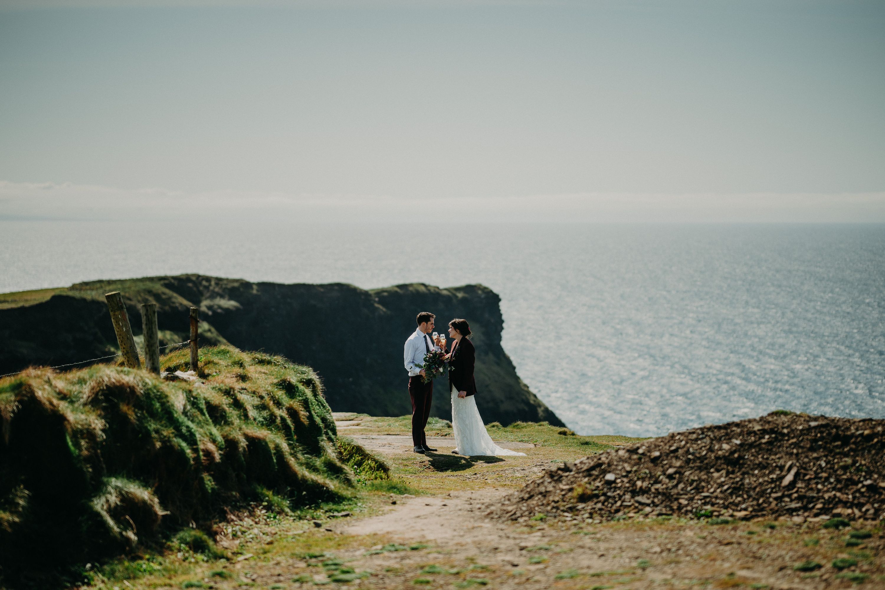 A bride and groom having a drink after getting married in a small wedding in Ireland