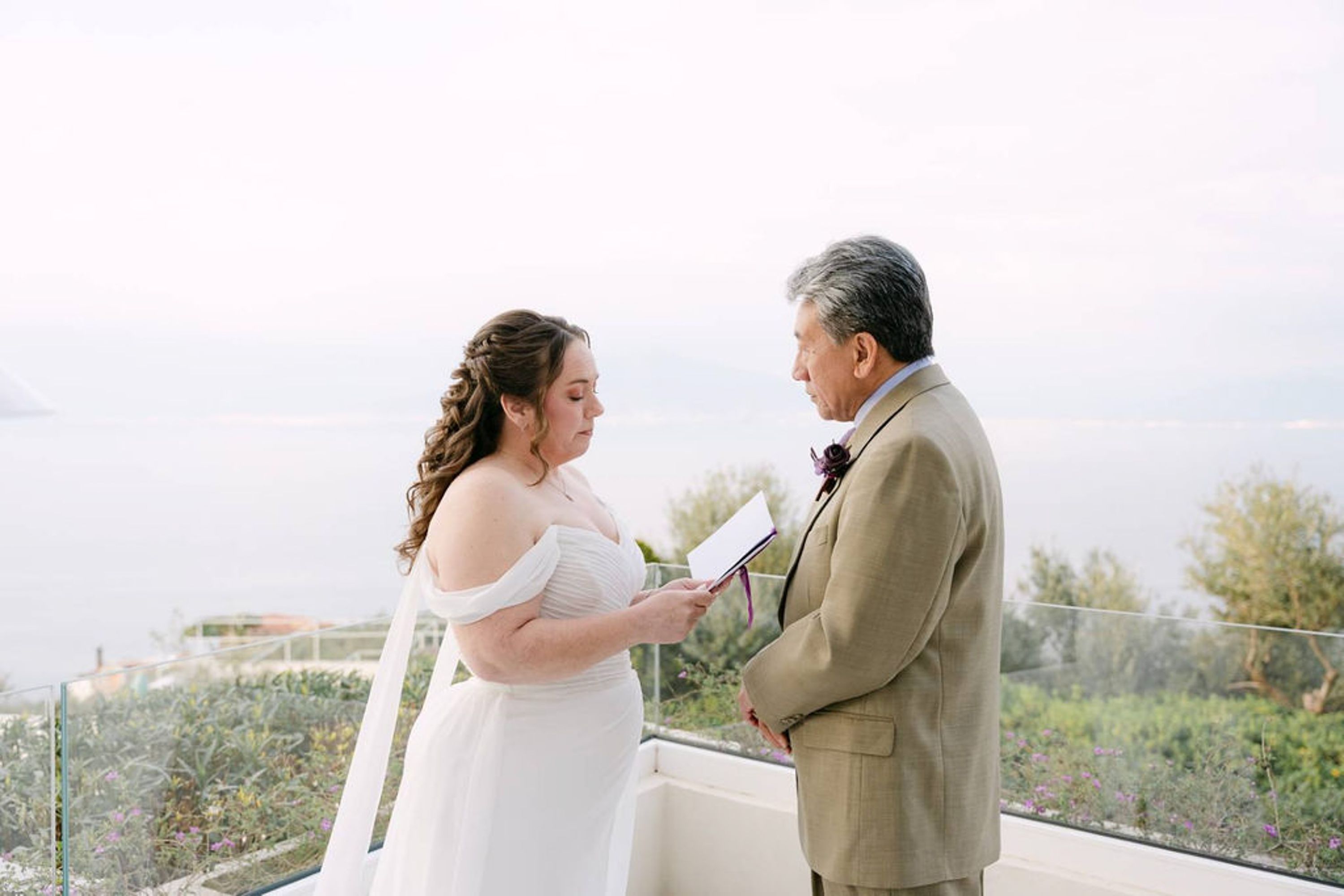 Bride reads handwritten vows to groom at a small wedding in Italy