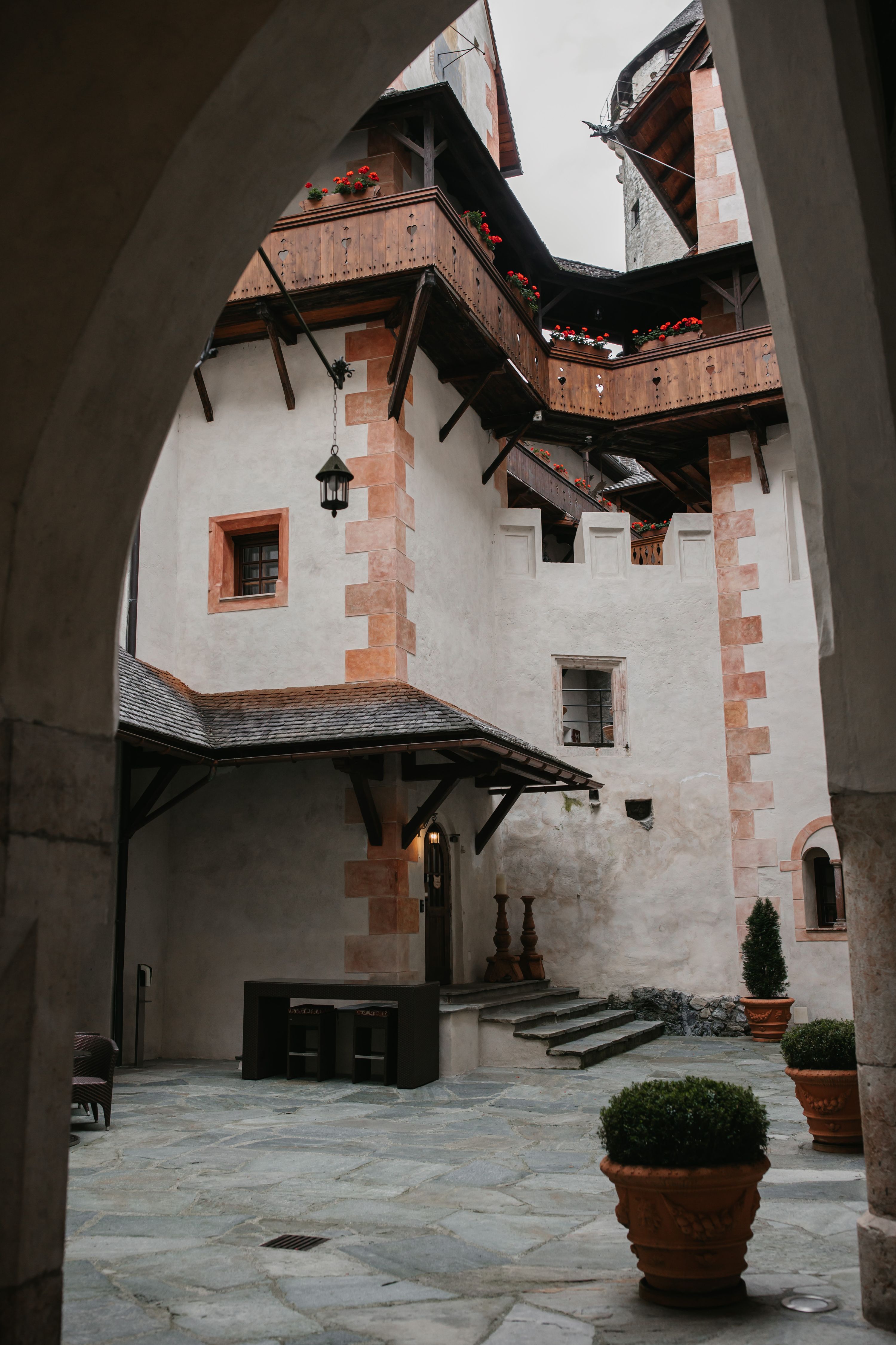 Flower-decked inner courtyard of a medieval castle in Austria