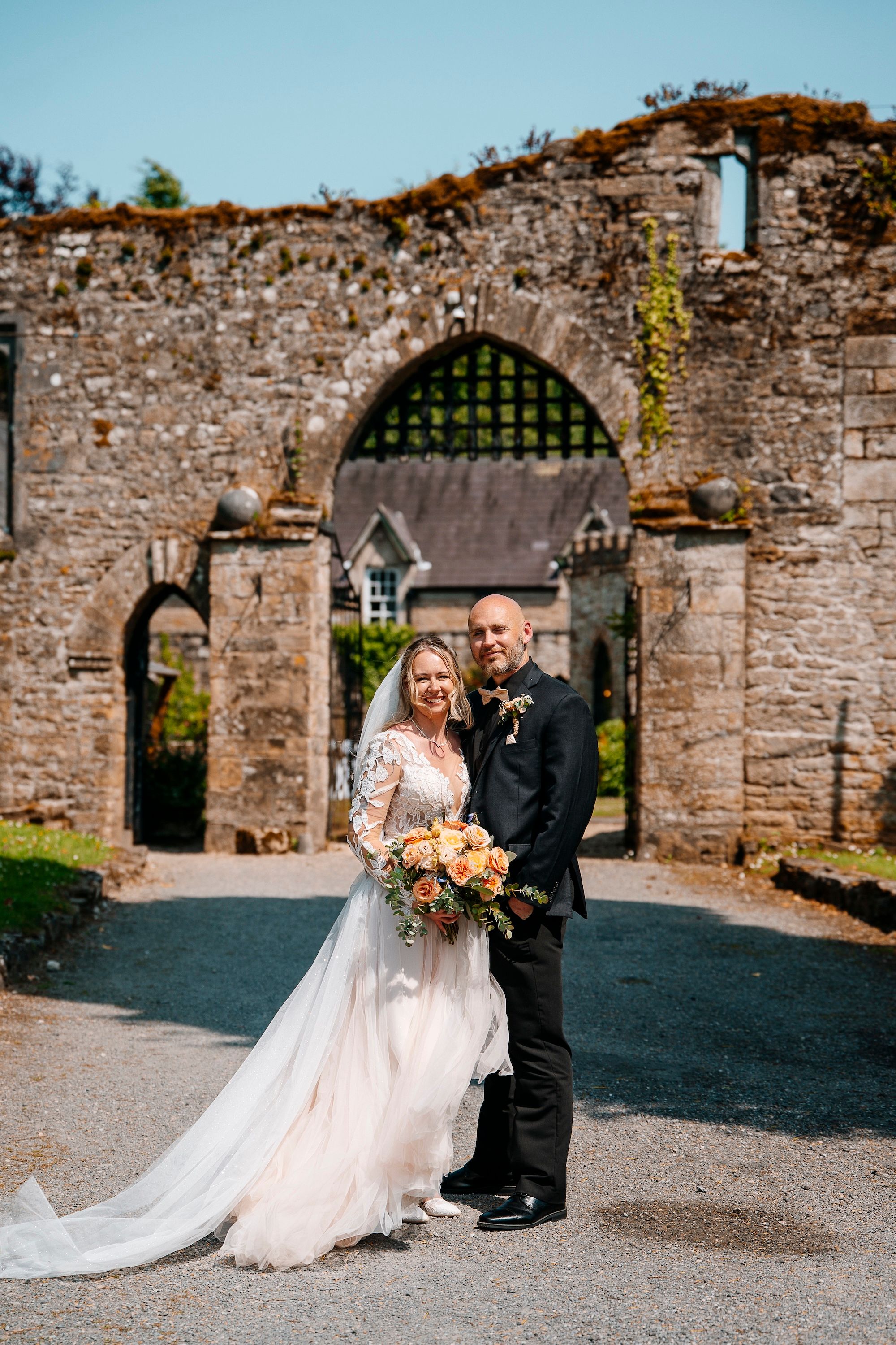 Newlyweds looking at the camera for the photoshoot of their intimate wedding in Ireland