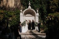 Bride and groom having a garden ceremony during their destination wedding in Portugal