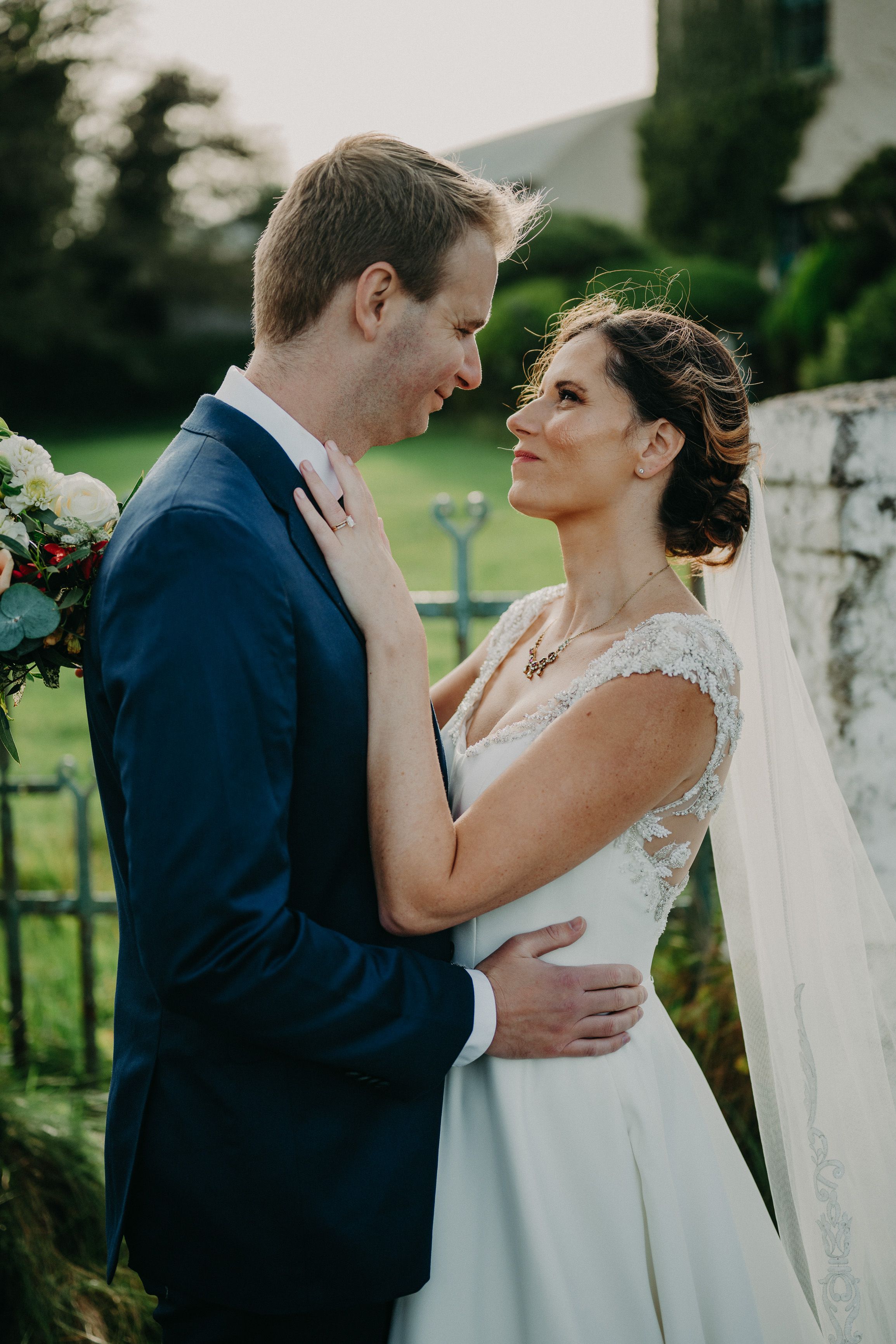 Intimate wedding in Ireland close-up of bride and groom holding each other during a private ceremony