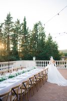 Bride looking at the table of the wedding reception for their destination wedding in Tuscany