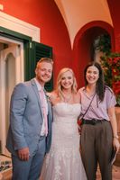 Destination wedding planner in Italy posing with a bride and groom
