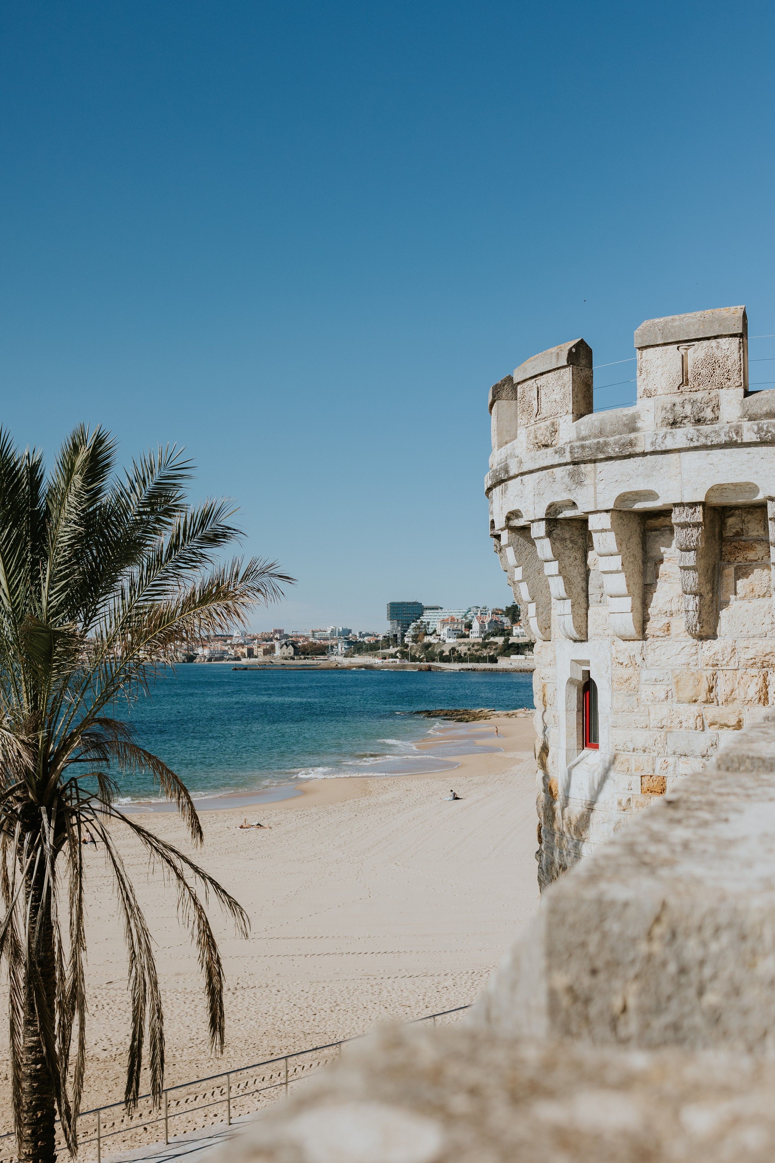 Turret of a palace in portugal with the cascais coast in the background