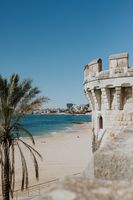 Turret of a palace in portugal with the cascais coast in the background
