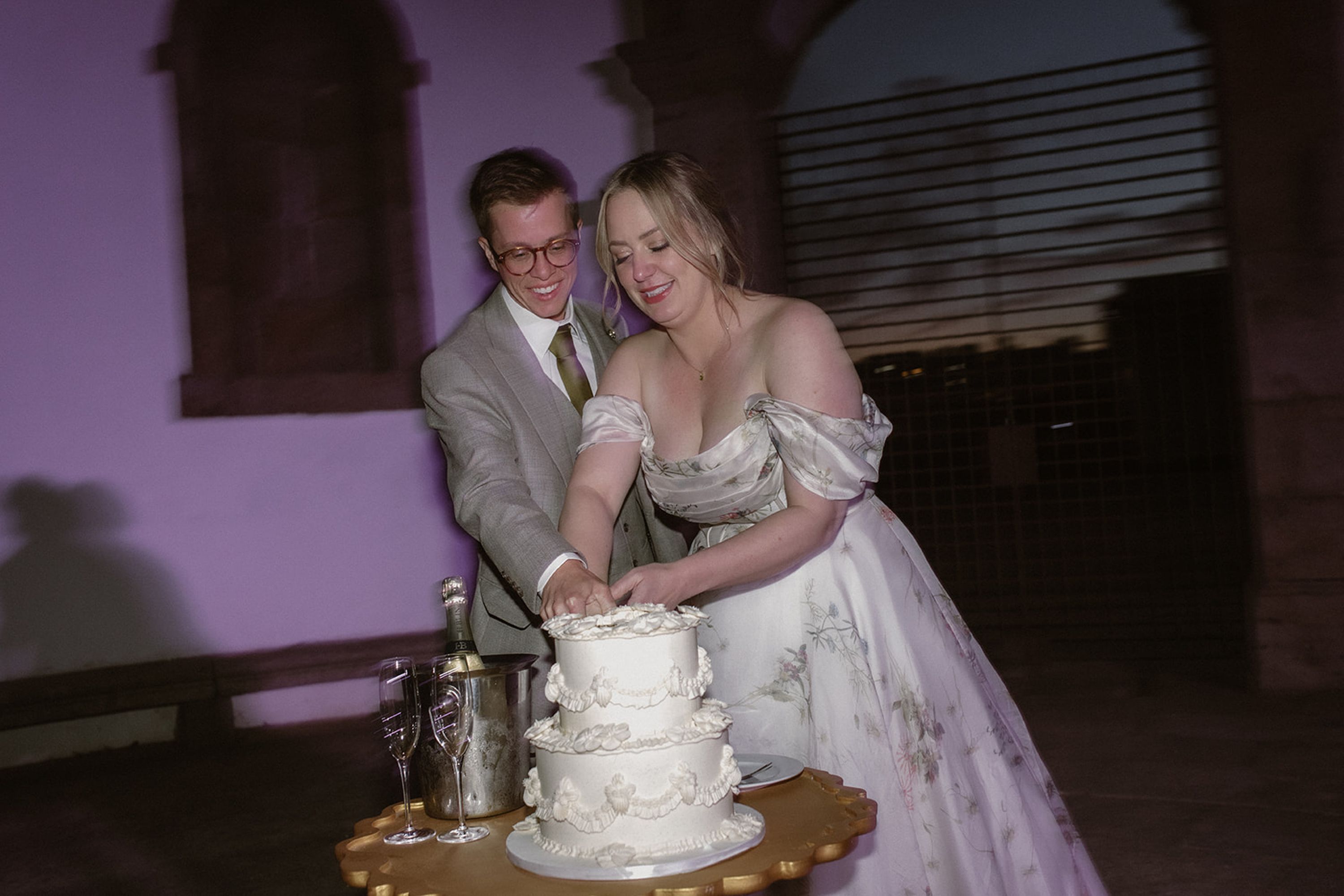 Couple cutting their wedding cake during an intimate wedding in Portugal reception