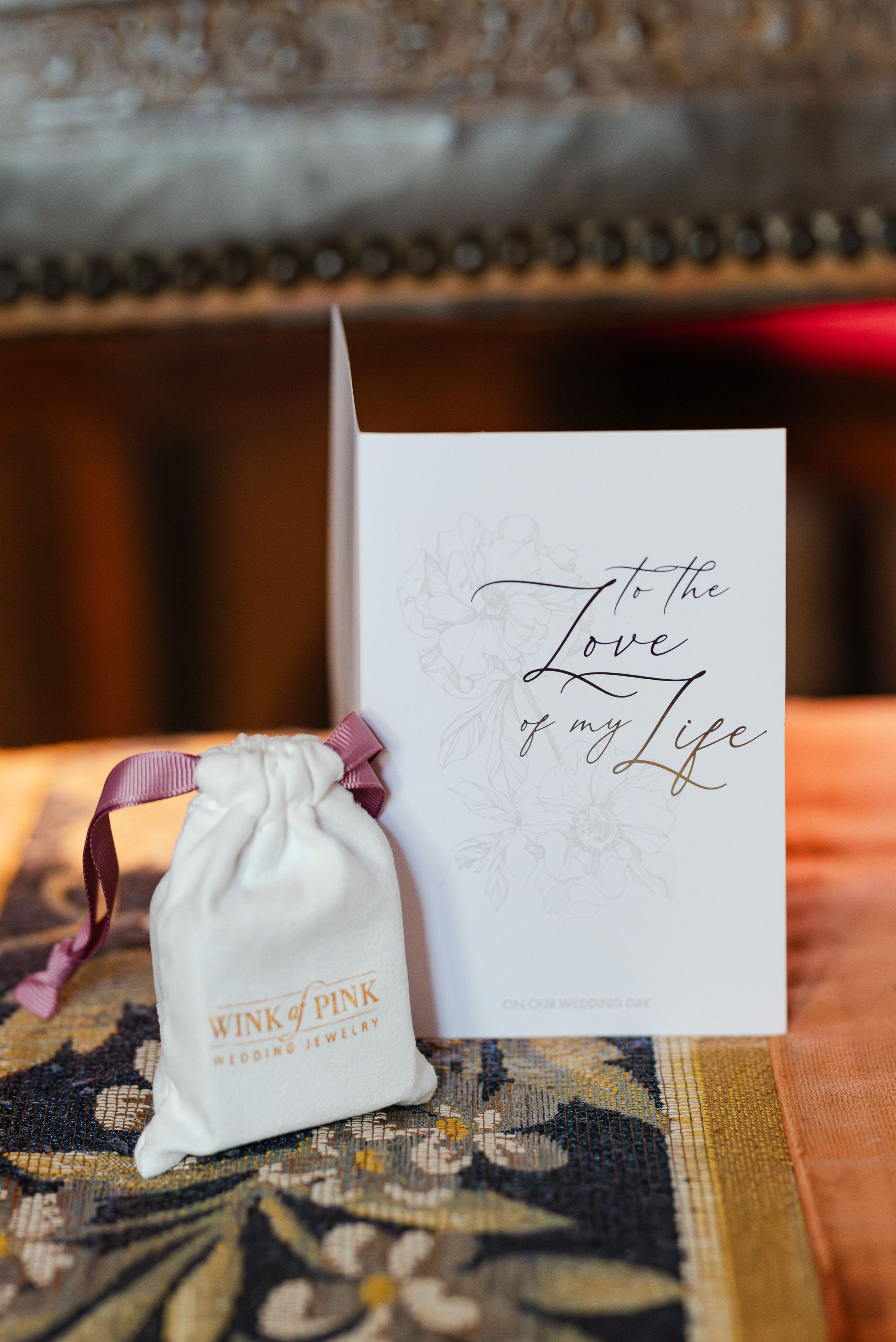 Wedding day gift and love letter styled on a rustic table during a small wedding in France