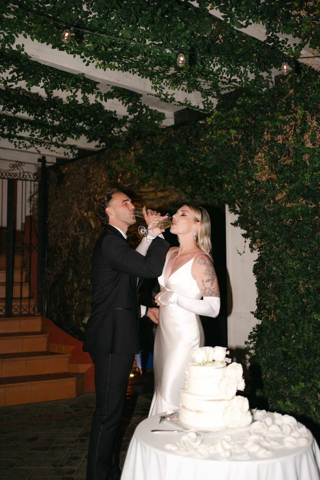 A bride and groom in the midst of their nighttime reception party during their small wedding in Italy