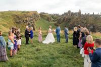 Bride and groom with their guests during an outdoor wedding ceremony in Northern Ireland